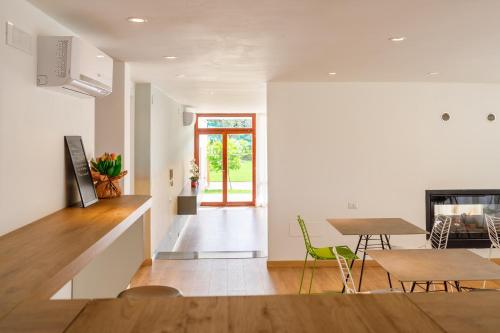 a kitchen and dining room with a table and chairs at ARIA - Villa di Campagna in Montecorvino Rovella