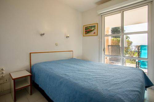 Posteľ alebo postele v izbe v ubytovaní Coté Jardin, Villa de Cap Esterel