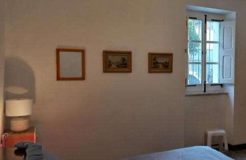 a bedroom with a bed and a window at The Englishmans Home in Cuglieri