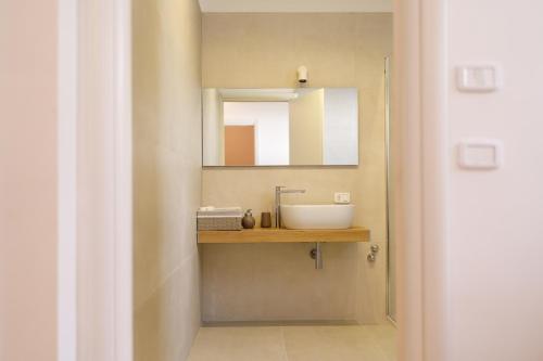a bathroom with a sink and a mirror at ARIA - Villa di Campagna in Montecorvino Rovella