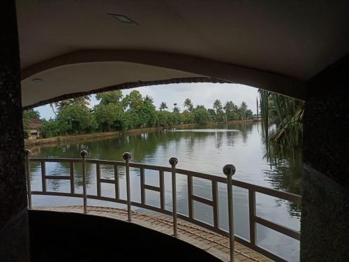 a view of a river from a bridge at Beach Paradise Day Cruise Houseboat in Alleppey