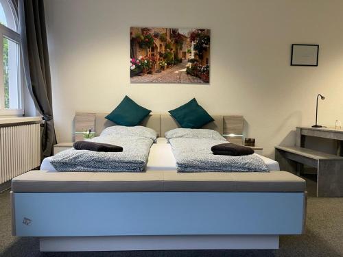 a bedroom with a bed with a blue light on it at Gäste-Liesel Bad Pyrmont in Bad Pyrmont