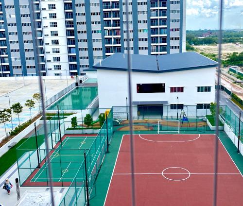 a tennis court on a building with buildings in the background at RumaMuji Kita KLIA, Putrajaya, Cyberjaya Musliem Only in Sepang
