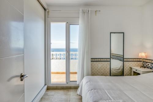 A bed or beds in a room at Casa con vistas al Mar Costa Bra