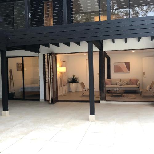 a living room with a couch in a house at The COCO in The Entrance