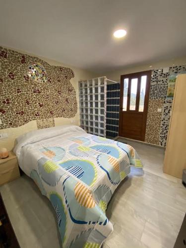 a bedroom with a bed in a room at LA CASONA in Siete Aguas