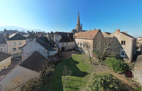 an aerial view of a city with buildings and a church at Maison Sainte Barbe in Autun