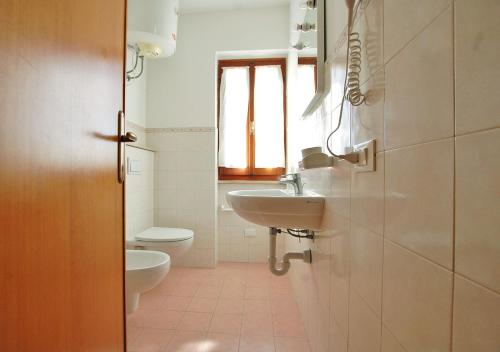 a bathroom with a sink and a toilet at Orizzonti in Marina di Campo