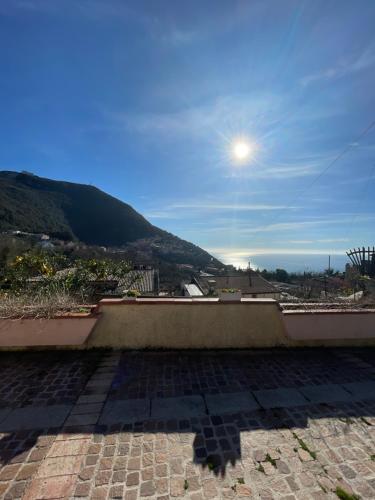 a view from the roof of a house with the sun in the sky at Casa Vacanze Primavera in Maratea