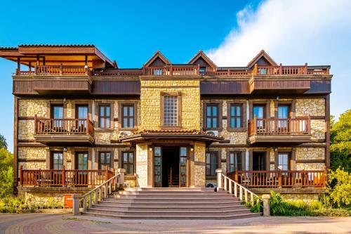 a large building with a staircase in front of it at Enso Inn in Fethiye