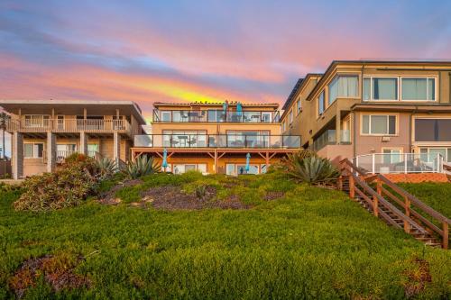 a large apartment building with a sunset in the background at 3009 Ocean Street in Carlsbad