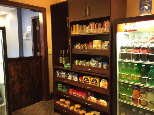 a refrigerator filled with lots of food and drinks at Wingate by Wyndham High Point Greensboro in High Point