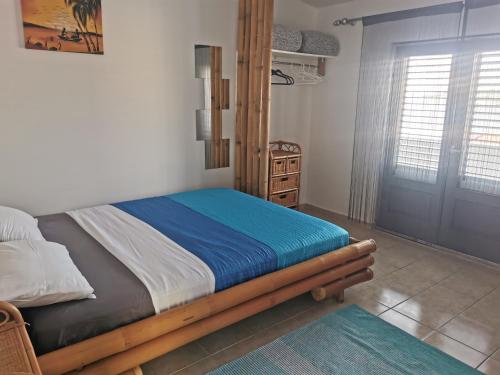 a bedroom with a bed with a wooden frame at Laura's dream Appartments in Pag