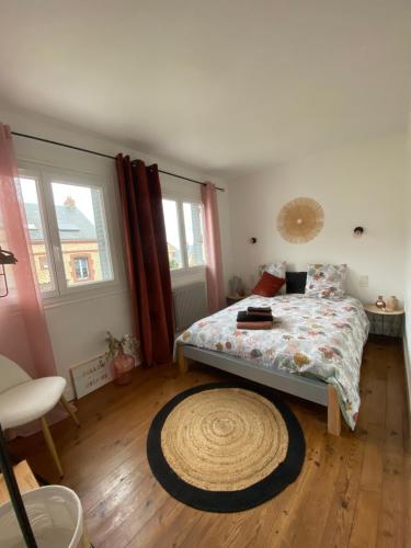 Ένα ή περισσότερα κρεβάτια σε δωμάτιο στο Petite maison de vacances