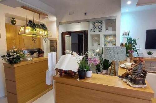 a store with flowers and plants on a counter at Melody Sorrento Suites in Sorrento