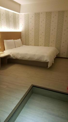 Tempat tidur dalam kamar di Honey Prince