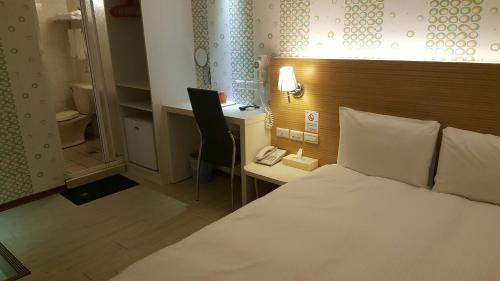 Tempat tidur dalam kamar di Honey Prince