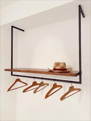 a shelf with a hat on a wall at Don Nicuzzo in Salemi