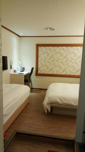 Tempat tidur dalam kamar di Honey Prince