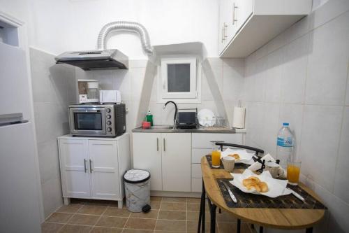 A kitchen or kitchenette at Akis studio Liston square area Corfu