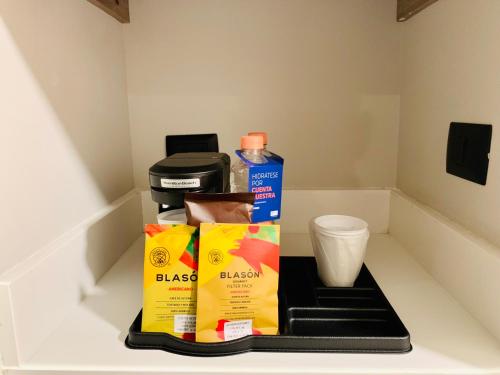 a shelf with a box of food and a cup at Holiday Inn Express - Guadalajara Vallarta Poniente by IHG in Guadalajara