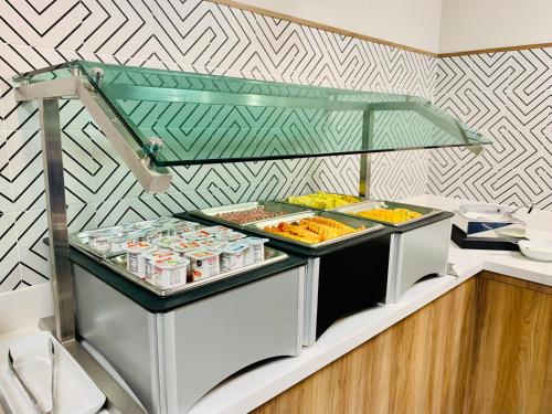a kitchen with a counter with food on it at Holiday Inn Express - Guadalajara Vallarta Poniente by IHG in Guadalajara