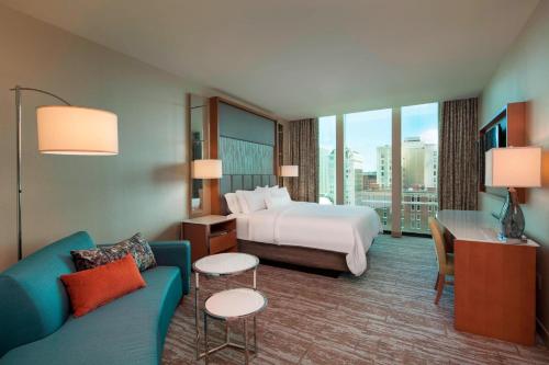 a hotel room with a bed and a couch at The Westin Chattanooga in Chattanooga