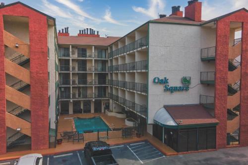 an apartment building with a swimming pool and a parking lot at Oak Square - Unit 403 in Gatlinburg