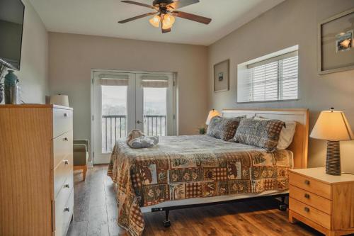 a bedroom with a bed and a ceiling fan at MVC - Unit 3707 - Sweet Wilderness in Pigeon Forge
