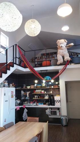 a teddy bear sitting on top of a shelf at Warak Guesthouse in Jeju