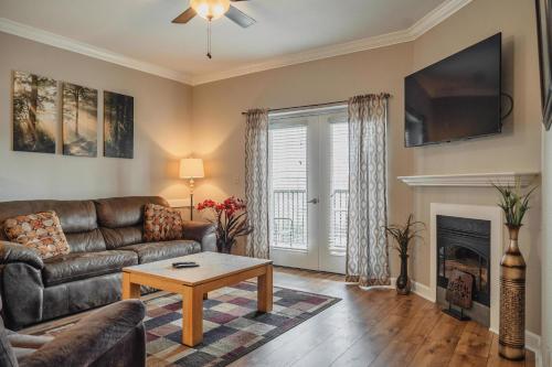 a living room with a couch and a table at MVC - Unit 3707 - Sweet Wilderness in Pigeon Forge