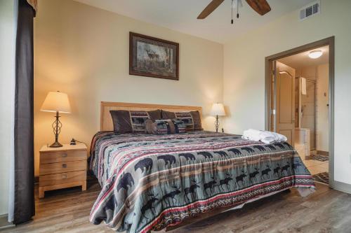 a bedroom with a bed and a dresser and lamps at MVC - Unit 2602 - Sweet Serenity in Pigeon Forge