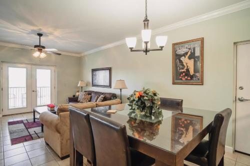 a living room with a table and a couch at MVC - Unit 1505 - Bearly Available in Pigeon Forge