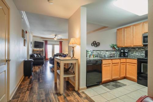 a kitchen with a table and a living room at MVC - Unit 1601- Sweet Butterfly in Pigeon Forge