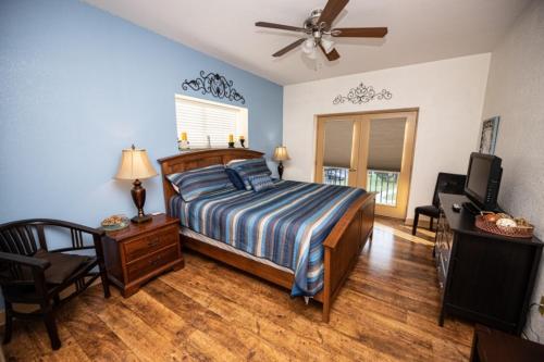 a bedroom with a bed and a ceiling fan at MVC - Unit 3301 - Making Memories in Pigeon Forge