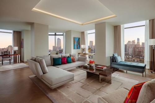 a living room with a couch and a table at The Ritz-Carlton, Baku in Baku