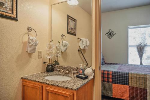 a bathroom with a sink and a mirror at MVC - Unit 3207 - Happy Place in Pigeon Forge