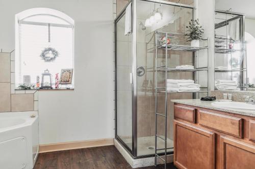 a bathroom with a glass shower and a sink at MVC - Unit 5707 - Hawks Nest in Pigeon Forge