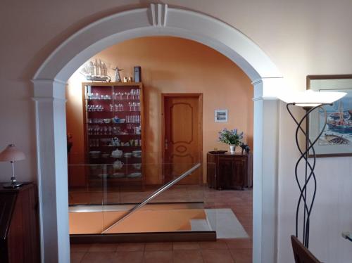 an archway in a room with a glass case at Palazzo con Vista in Corfu