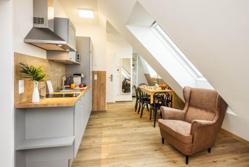 a kitchen and dining room in a loft at Jimmy's Apartments Lory in Vienna