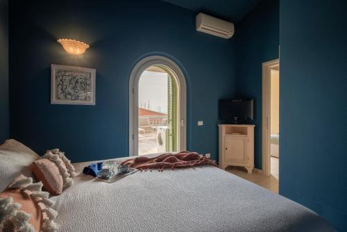 Ένα ή περισσότερα κρεβάτια σε δωμάτιο στο Villa Teti
