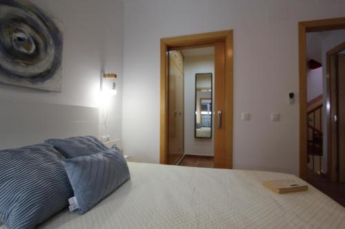 Postel nebo postele na pokoji v ubytování ConiL Casa H&L