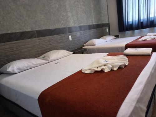 Katil atau katil-katil dalam bilik di Hotel Albatros