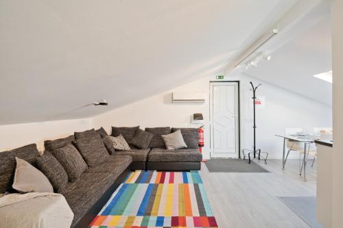 a living room with a couch and a table at BmyGuest - Cascais Beach Villa II in Cascais