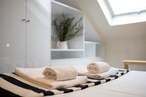 two towels sitting on top of a counter in a bathroom at Alfama District by be@home in Lisbon