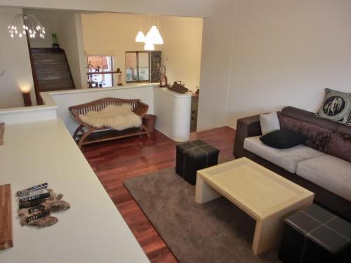 a living room with a couch and a table at Sigang Vacation Homestay in Xigang