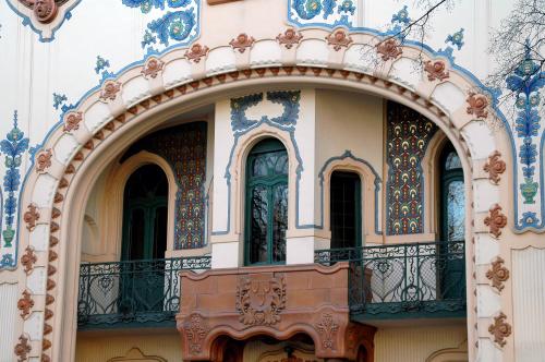 an archway on a building with blue and white tiles at ĐILL 2 APARTMANTS in Subotica