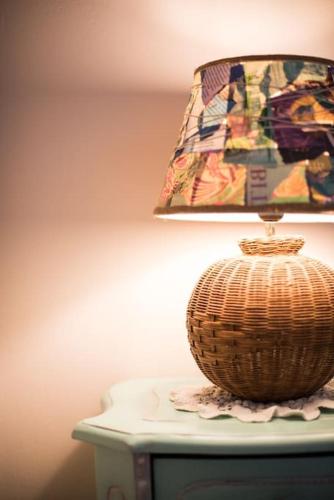 a lamp sitting on top of a table at Papa-Antonis Stone House in Zarós