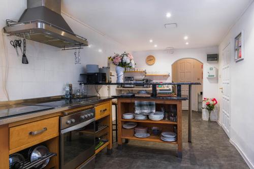 a kitchen with a sink and a counter with dishes at Willa Jelitkowska in Gdańsk