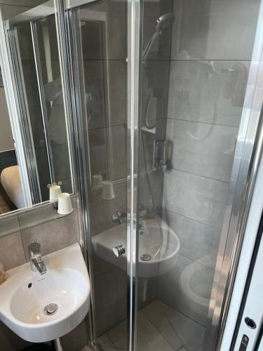 a bathroom with a shower and a sink at Mary's Hotel République in Paris